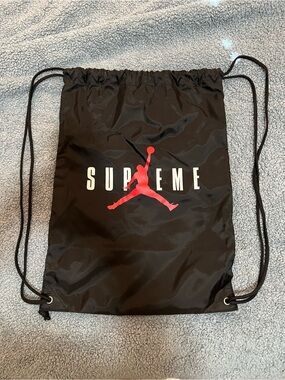 Supreme Black Drawstring Backpack with Red Jumpman Logo